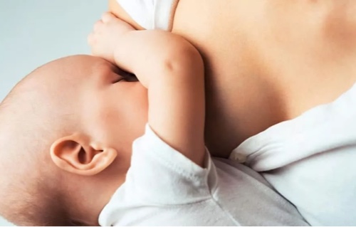 Postnatal Mom Breastfeeding to Baby